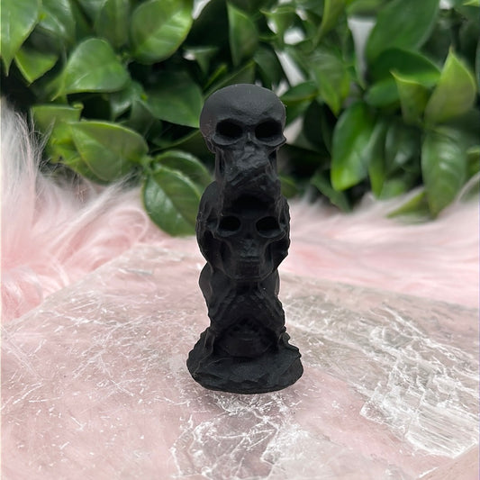 Matte black obsidian say no hear no see no evil skull carving