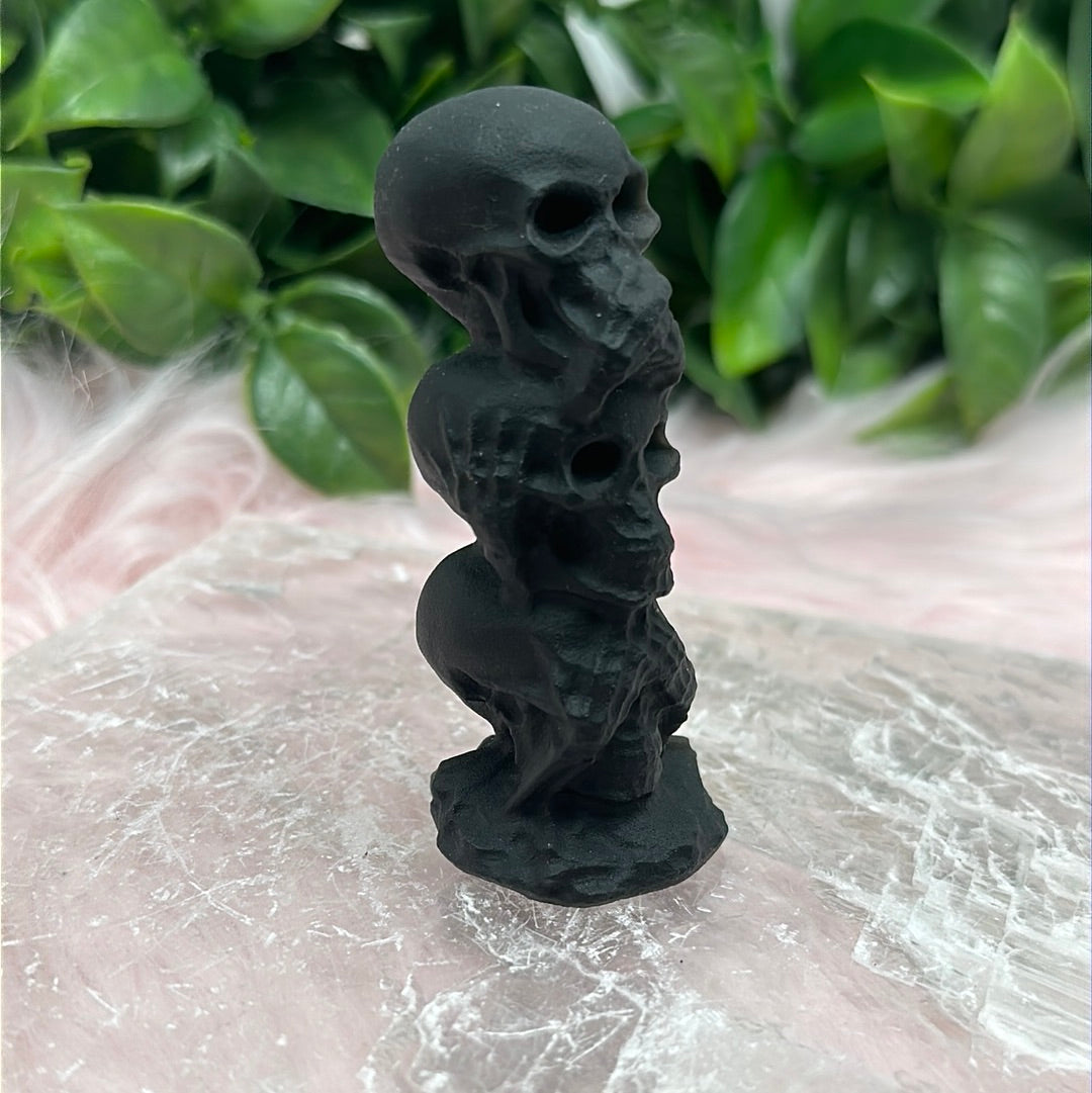 Matte black obsidian say no hear no see no evil skull carving